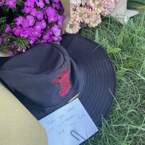 A note left on a school hat says: “Hope you sleep well in heaven Max.”