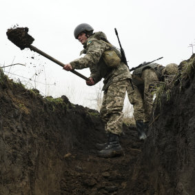 Ukrainian soldiers dig trenches at a position near the front line with Russia-backed separatists in Shyrokyne, eastern Ukraine.