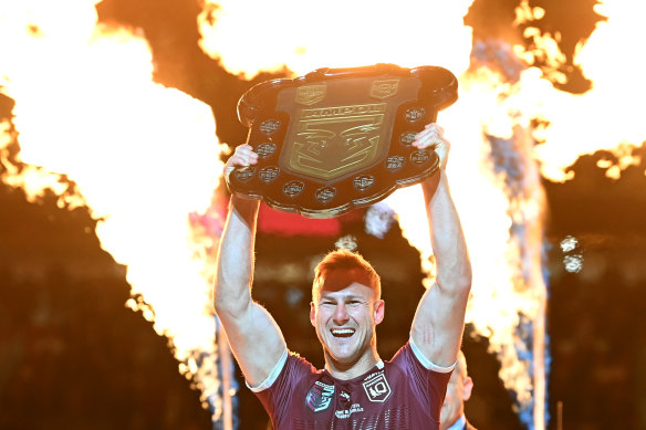 Daly Cherry-Evans celebrates with the shield after winning game three.