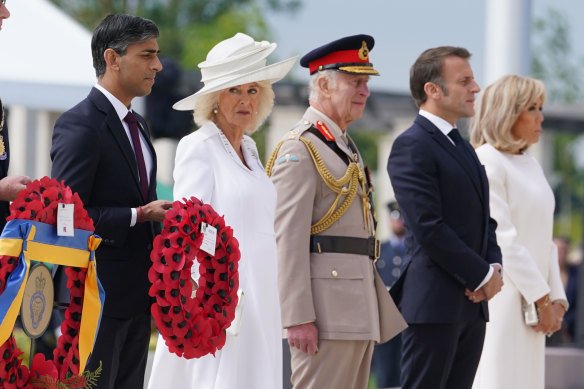 British Prime Minister Rishi Sunak, Queen Camilla, King Charles, French President Emmanuel Macron and wife Brigitte Macron at the Normandy Memorial on Thursday. Sunak did not stay long.