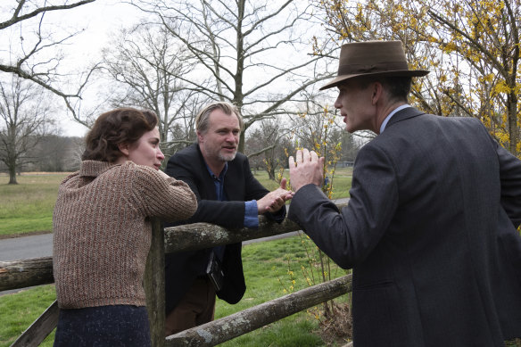Emily Blunt (left) with director Christopher Nolan (middle) and Cillian Murphy on the set of <i>Oppenheimer</i>.
