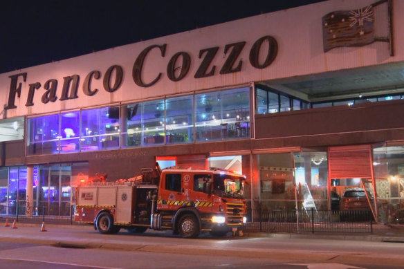 Firefighters at the scene after a car slammed into Moon Dog Wild West.