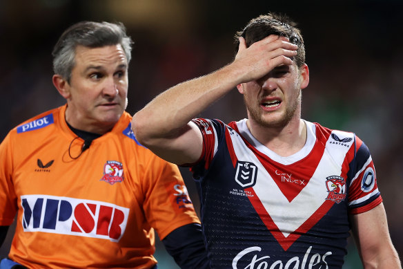 A distressed Luke Keary leaves the field after suffering a head knock against the Storm.