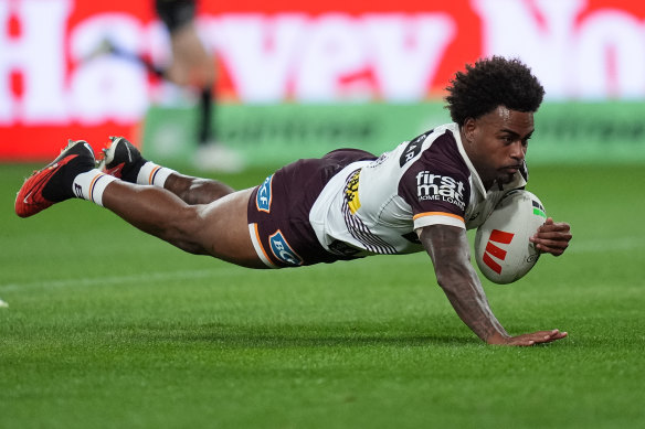 Ezra Mam dives over to score for the Brisbane Broncos against the Melbourne Storm.
