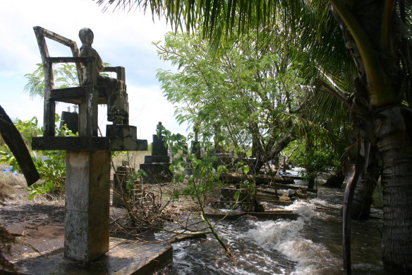 A king tide erodes a graveyard in the Torres Strait.