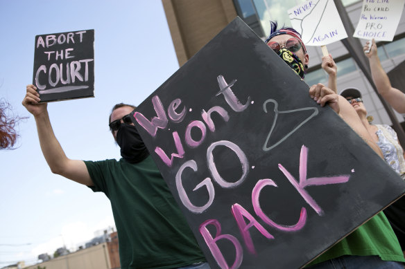 Charlie Wayne, left, Jasper Nieves and other demonstrators advocate for a woman’s right to an abortion in Roanoke, Virginia.