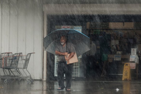 A resident carries supplies in Ocean View, Hawaii.