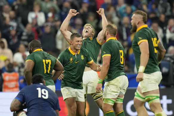 South African players celebrate after beating France.