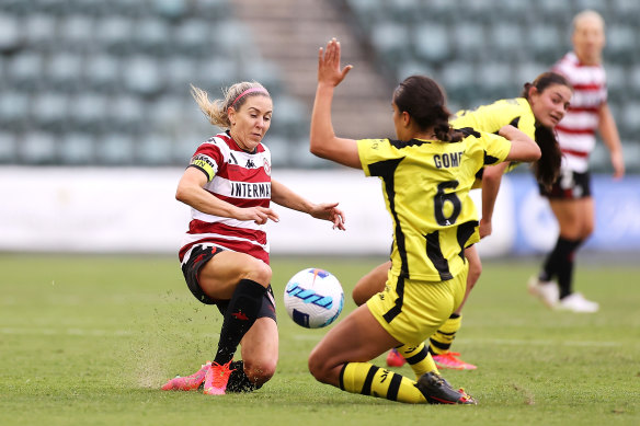 Erica Halloway is tackled by Isabel Gomez at WIN Stadium.