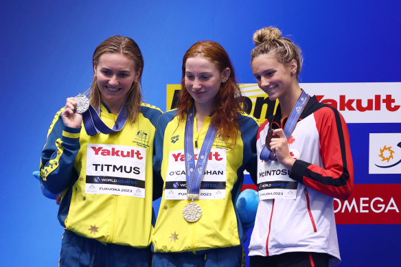 Titmus with training partner Mollie O’Callaghan (middle) and Canadian gun Summer McIntosh (right),
all pictured at the 2023 World Championships.