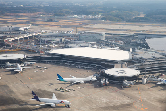 Narita (pictured) is almost 80 kilometres from Haneda Airport.