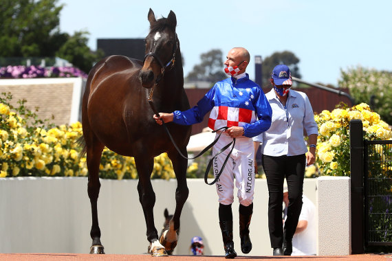 Glen Boss and Makybe Diva commemorate the legendary mare's three Cup wins at Flemington on Tuesday.