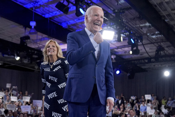 President Joe Biden, right, and first lady Jill Biden walk off stage after speaking at a campaign rally, Friday, June 28, 2024, in Raleigh, North Carolina