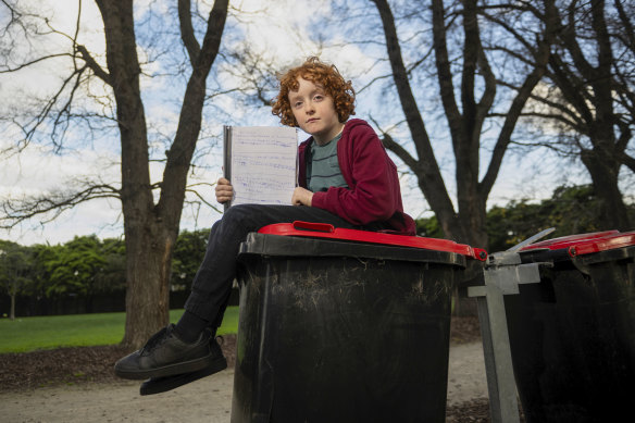 Jack Adams with his handwritten petition for recycling bins, which was initially knocked back by Merri-bek council.