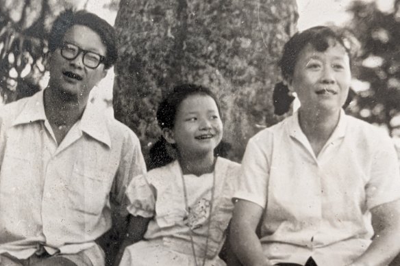 Journalist Cheng Lei (centre, aged 9) with dad Chu-yong and mum Hua in Hunan province, China, 1984, right before Chu-yong came to Australia as a visiting scholar.