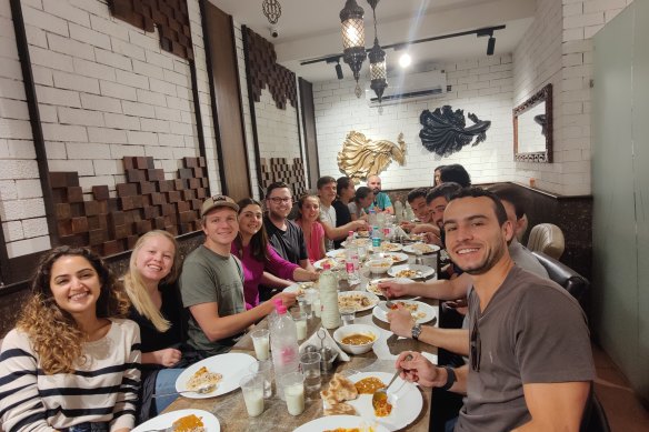 Travellers washing their Afghan meals down with cold glasses of ayran, a salty, mint-infused yoghurt drink, at Mazaar restaurant during the tour.