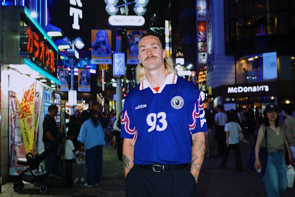 Socceroo Jackson Irvine wearing a retro Japan jersey in a picture he posted to social media.