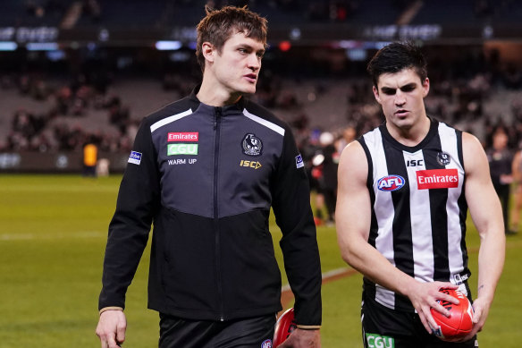 Darcy Moore left the field after hurting his hamstring.