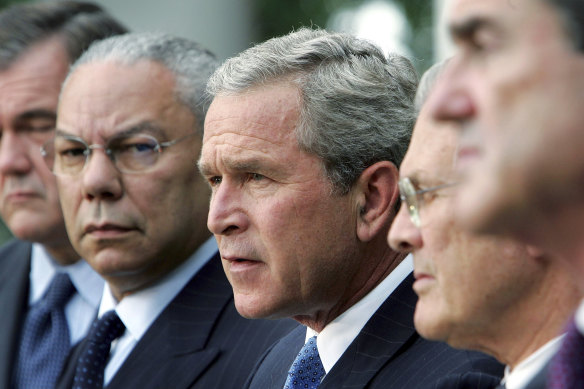 Powell, left, pictured with president George W Bush, centre, in 2004.