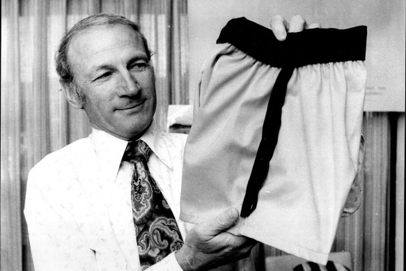 The secretary of Balmain Rugby League Club, Mr Keith Gittoes, with the proposed "TV" style of shorts for Balmain's team. February 26, 1975 