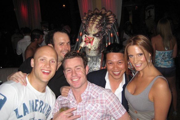 Gary Ablett and Steve Johnson (front left) with Nguyen in Las Vegas. There is no suggestion others photographed with Nguyen are involved in his alleged behaviour.