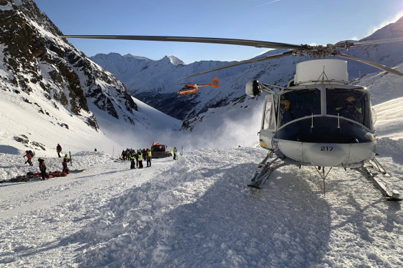 Rescuers at work following the avalanche in Val Senales that killed a woman and a two children. An Alpine rescue corps spokesman says helicopters are searching for any other possible victims.