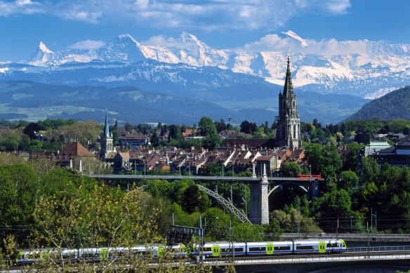 The Swiss Alps and the old town of Bern. Taking it all in from the train.