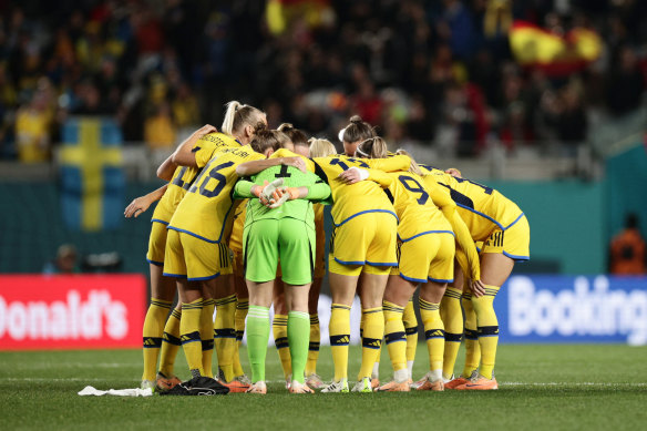 Swedish players huddle ahead of the second half.