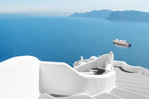 Explora sails by the Greek island of Santorini.