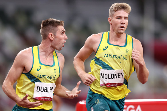 Ash Moloney gets encouragement from Cedric Dubler in the last event of the decathlon at the Tokyo Olympics.