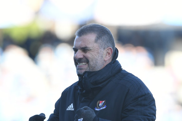 Ange Postecoglou celebrates as Yokohama F. Marinos clinch the title.