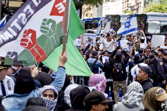 Supporters of Israel and Palestine gather at the Israeli consulate in New York on Monday.