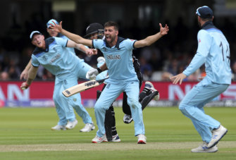 England's Mark Wood celebrates the dismissal of New Zealand's Ross Taylor.