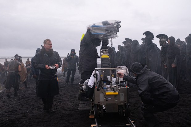 Director Christopher Nolan (frame left) on set of his film THE ODYSSEY, written, produced, and directed by Christopher Nolan.