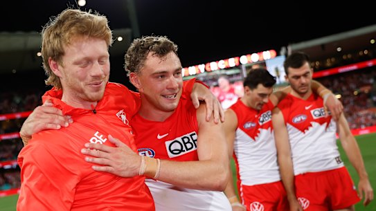 Injured Swans skipper Callum Mills (left) with Will Hayward after the preliminary final win over Port Adelaide.