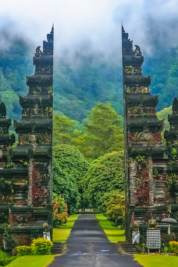 A gate to a Hindu temple, set amid jungle.