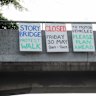 Signs went up on the Story Bridge warning of the protest on Friday.