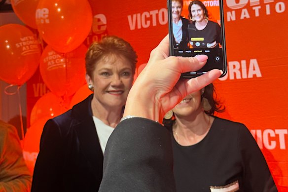 Fans pose for selfies with Pauline Hanson at a One Nation fundraiser.