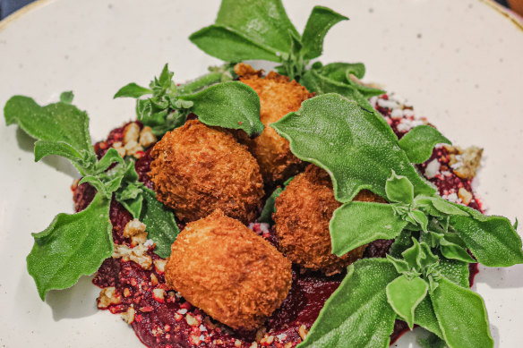 The set menu at Marrickville cafe Ruby Lonesome includes crumbed potato and kutjera feta dumpling with beetroot puree.