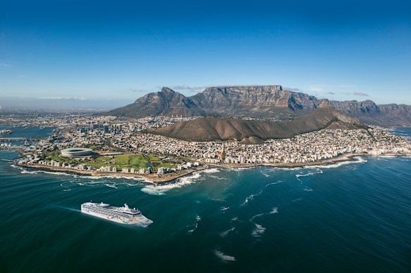 The cruise ship Norwegian Dawn passes along the spectacular coastline and peaks of Cape Town., South Africa.