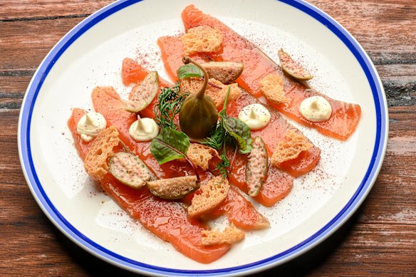 Cured salmon with caper berries, dill and creme fraiche.