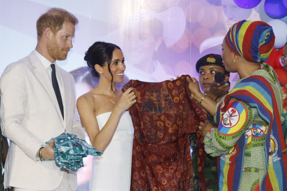 Meghan received a Nigerian fabric as a gift alongside Harry at an Invictus Games event.