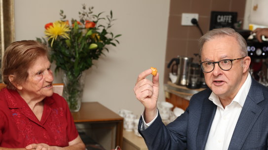 Prime Minister Anthony Albanese has morning tea during a visit to a home in Downer