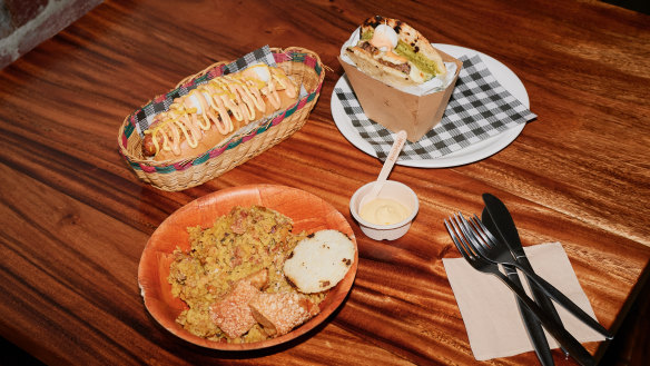 Berbeo Bros serves Colombian-style dishes such as Lechona Berbeo, hot dogs squiggled with pineapple sauce and mayo, and burgers made with arepas.