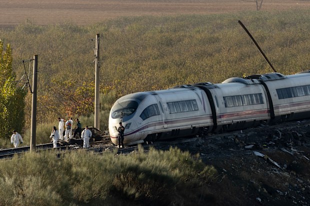 Security forces work at the scene of a train crash on October 29, 2026 near Yebenes, in Toledo province, Spain.