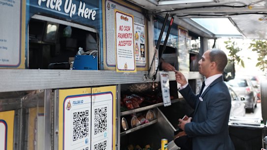 Vincent Morr orders lunch from a cashless food truck in San Francisco.