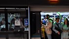 Passengers squeeze on a metro train at Crows Nest station during the morning peak.