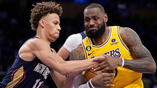 New Orleans guard Dyson Daniels attempts to stop a drive from LA Lakers superstar LeBron James.