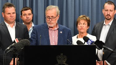 NSW Leader of the Shooters, Fishers and Farmers Party Robert Borsak (centre) speaks to the media on Friday.