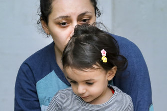 In this photo released by the Armenian Foreign Ministry on Sunday, September 27, 2020, a woman with her child sit in a bombshelter to protect against shelling, in Stepanakert, the self-proclaimed Republic of Nagorno-Karabakh, Azerbaijan. 